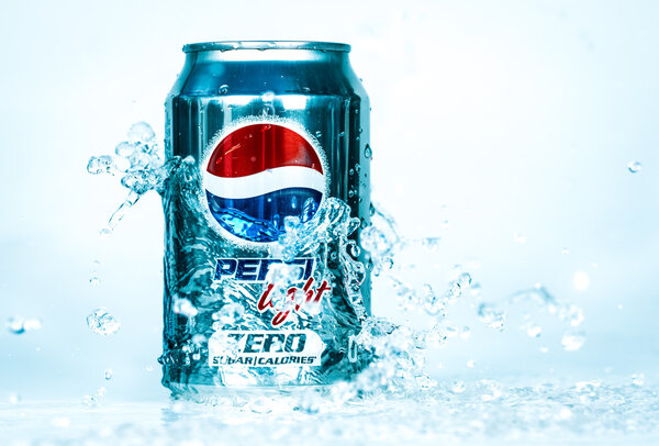 Can of Pepsi cola Lignt in water.