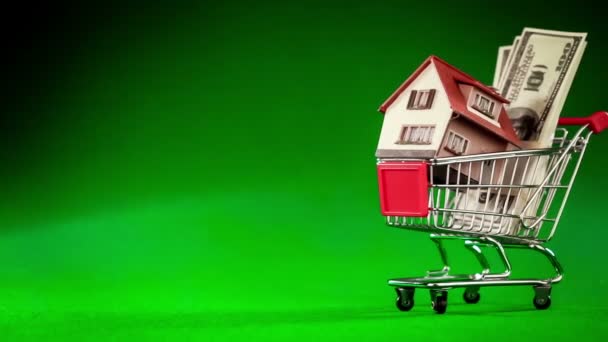 Shoppingvagn och hus — Stockvideo