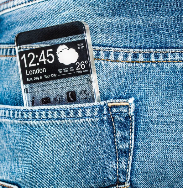 Smartphone con pantalla transparente en un bolsillo de jeans . — Foto de Stock