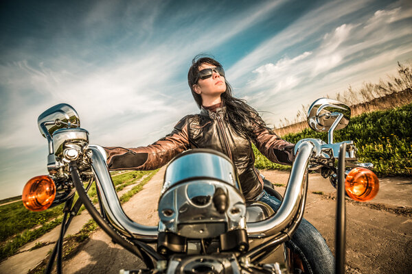 Biker girl on a motorcycle