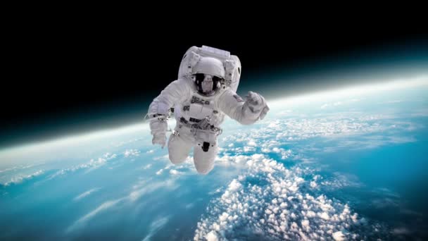 Astronauta en el espacio exterior contra el telón de fondo del planeta Tierra. Elementos de esta imagen proporcionados por la NASA. — Vídeos de Stock