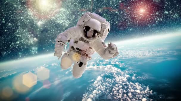 Astronauta w kosmosie na tle planety Ziemia. Elementy tego obrazu dostarczone przez NASA. — Wideo stockowe