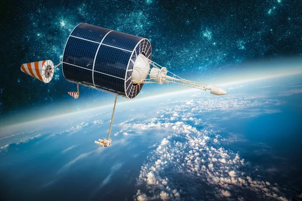 Space satellite over the planet earth — Stock Photo, Image