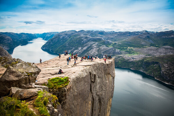 NORWAY- June 22, 2015: Preikestolen or Prekestolen, also known by the English translations of Preacher's Pulpit or Pulpit Rock, is a famous tourist attraction in Forsand, Ryfylke, Norway