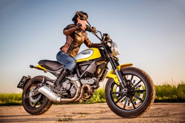 Biker girl on a Scrambler Icon Ducati clipart