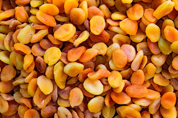 Dried apricot fruit forming a background. — Stock Photo, Image