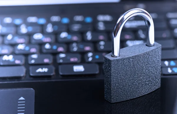 Padlock on laptop computer keyboard — Stock Photo, Image