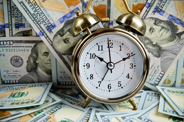 Alarm clock over money — Stock Photo, Image