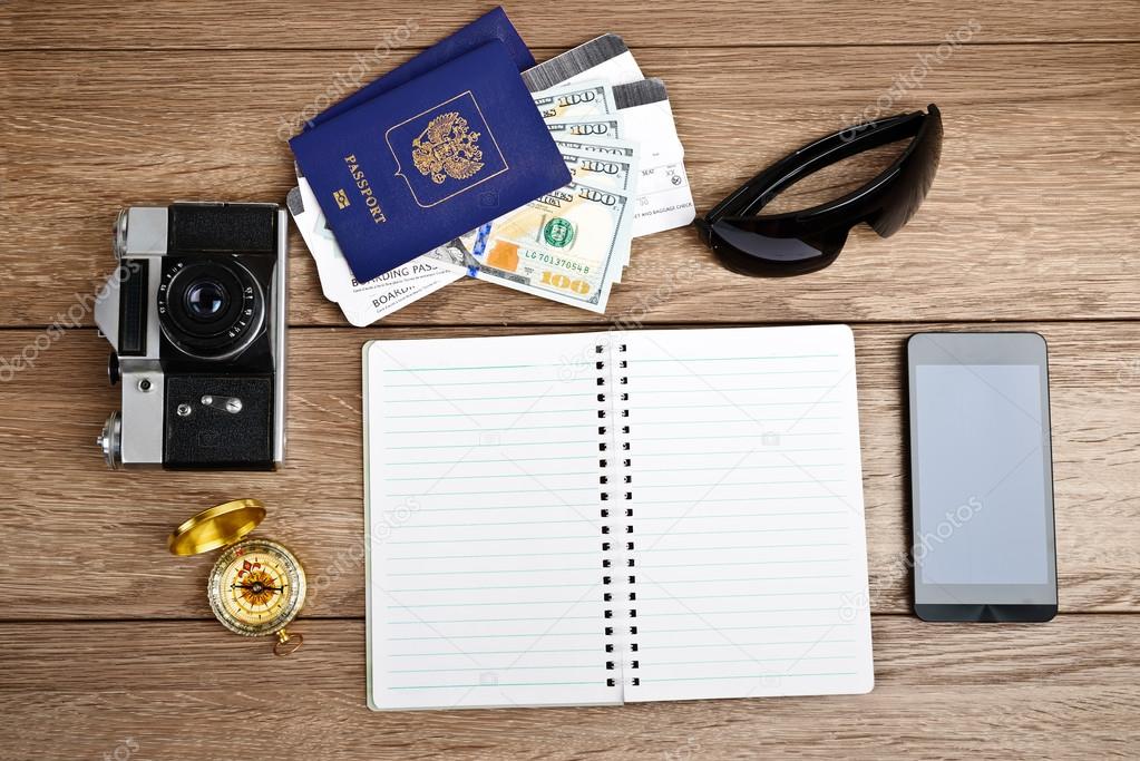 tourism concept: air tickets, passports, smartphone, compass, ca