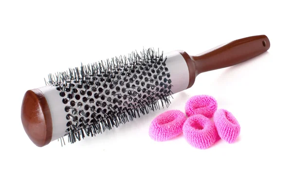 Salon round hairbrush with hair accessories — Stock Photo, Image