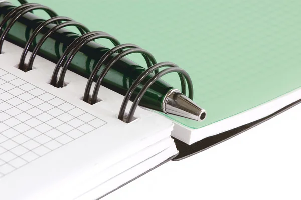 Open notebook with green pen — Stock Photo, Image