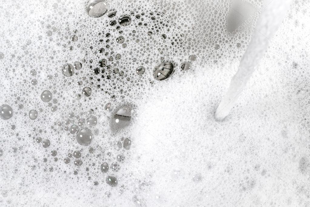 water washing foam in the kitchen sink