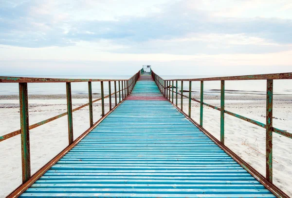 Sunny deserted old pier — Stock Photo, Image