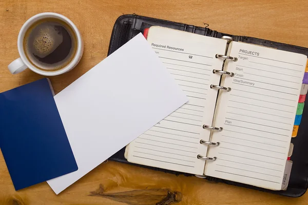 Diario aperto, passaporto e una tazza di caffè — Foto Stock