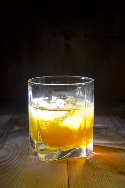 Glass of whiskey with ice — Stock Photo, Image