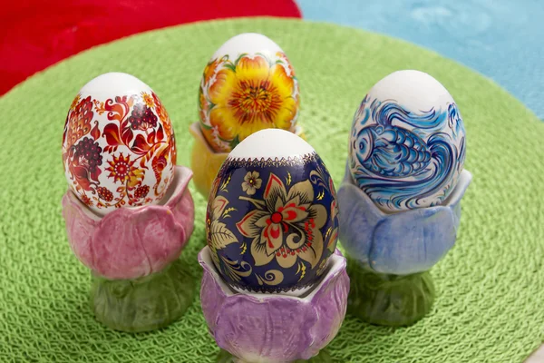 Easter eggs in colorful stands — Stock Photo, Image