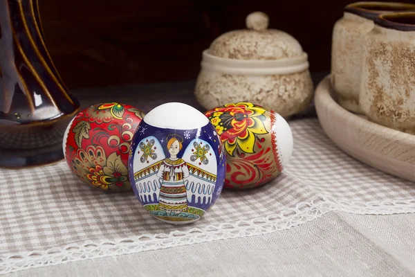 Multi-colored Easter eggs on a linen tablecloth — Stock Photo, Image