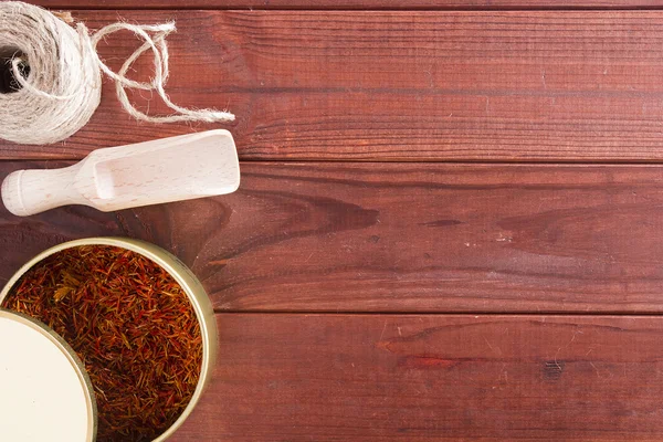 Dried saffron spice and material for packaging — Stock Photo, Image