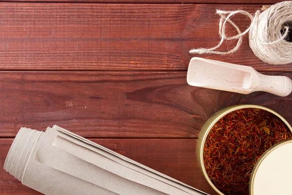 Dried saffron spice and material for packaging — Stock Photo, Image