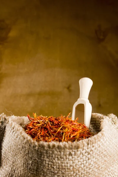 Spices saffron in a bag — Stock Photo, Image