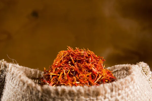 Spices saffron in a bag — Stock Photo, Image