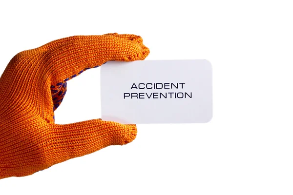 Επαγγελματική κάρτα στο χέρι σε πορτοκαλί γάντι — Φωτογραφία Αρχείου