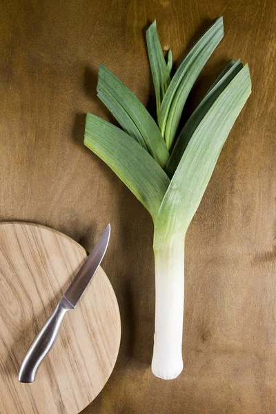 Leek on a wooden wall — Stock Photo, Image