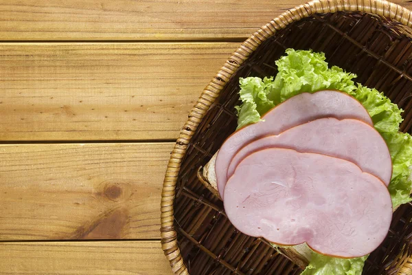 Open sandwich in a wicker basket — Stock Photo, Image