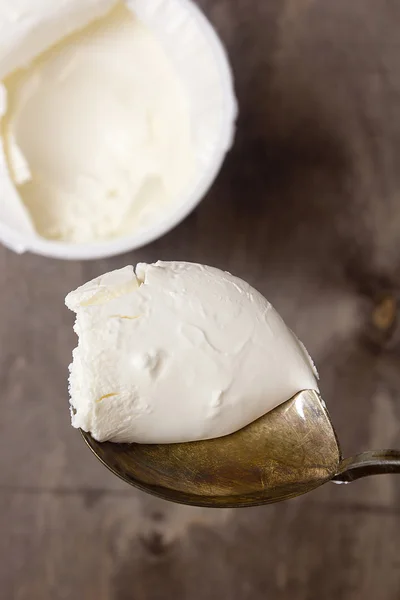 Mascarpone cheese in an old spoon — Stock Photo, Image