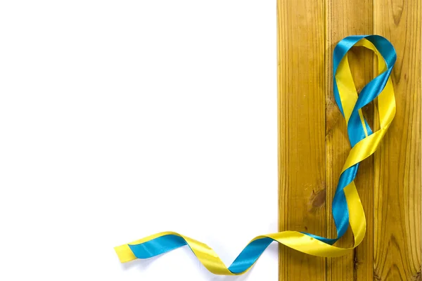 Yellow and blue satin ribbons — Stock Photo, Image