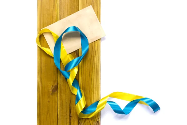 Yellow and blue satin ribbons — Stock Photo, Image