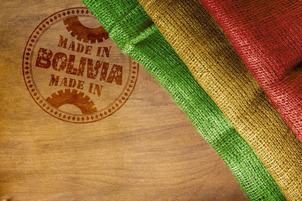 Impronta del Made in Bolivia su una superficie di legno — Foto Stock