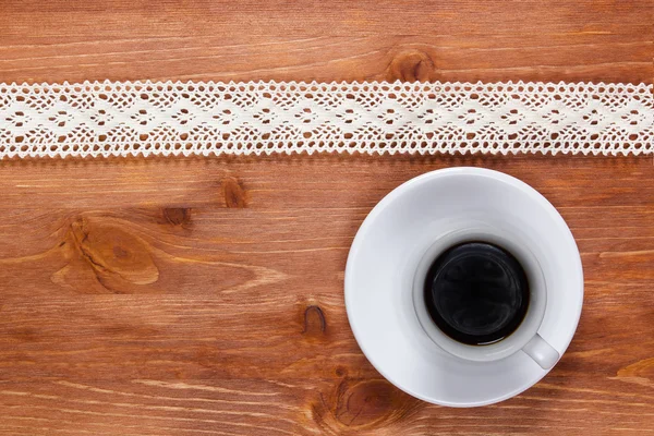 Openwork lace and cup of coffee — Stock Photo, Image