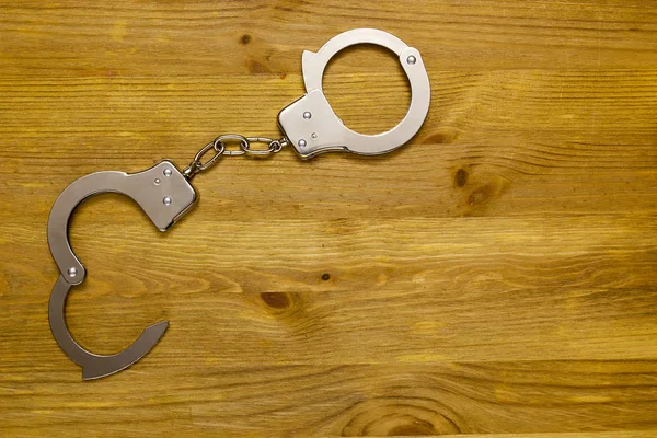 Tool restriction of freedom - the handcuffs — Stock Photo, Image