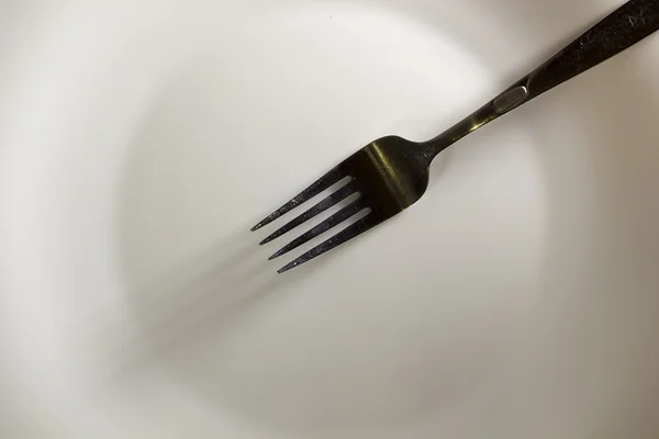 White plate and fork — Stock Photo, Image