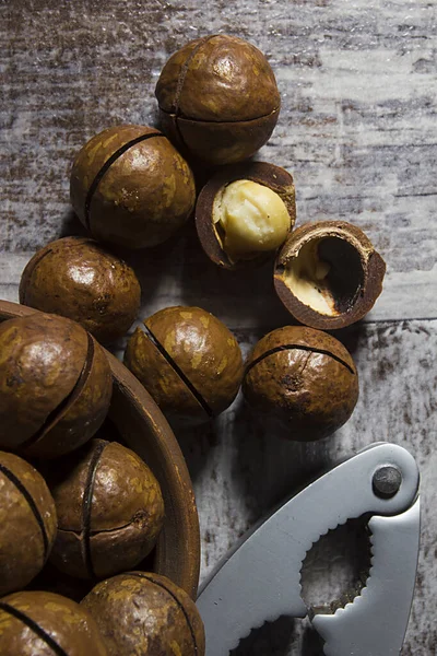 Macadamia Nuts Nutcracker Wooden Table — Stock Photo, Image