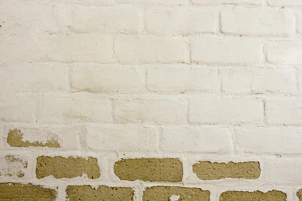 Brick wall with old painting — Stock Photo, Image