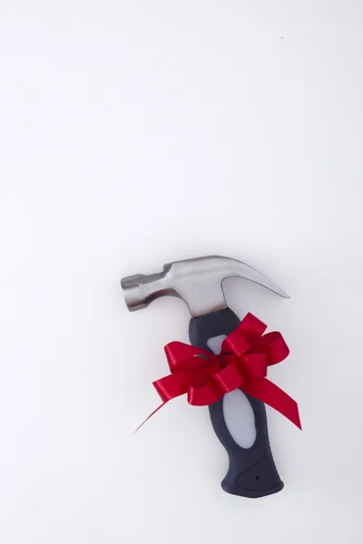 Small hammer with a bow — Stock Photo, Image