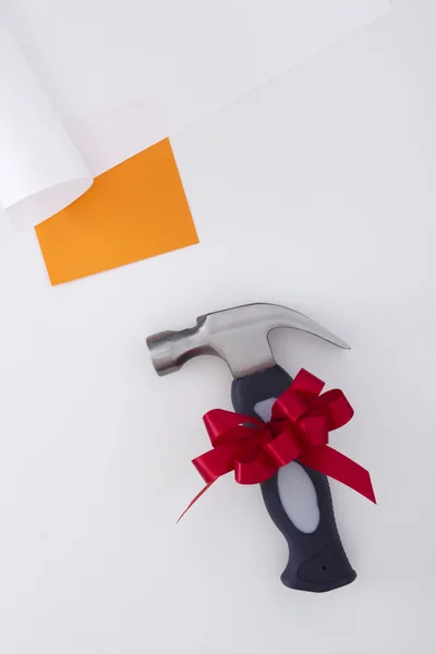 Small hammer with a bow — Stock Photo, Image