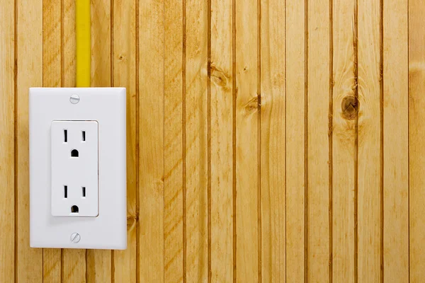 Outlet on a wooden wall — Stock Photo, Image