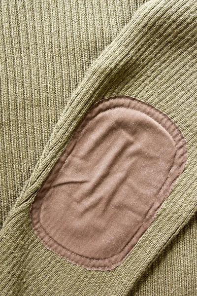 Łatka na rękawem sweter — Zdjęcie stockowe