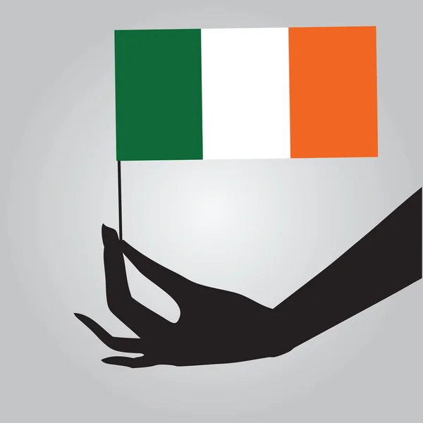 Mão com bandeira irlandesa — Vetor de Stock