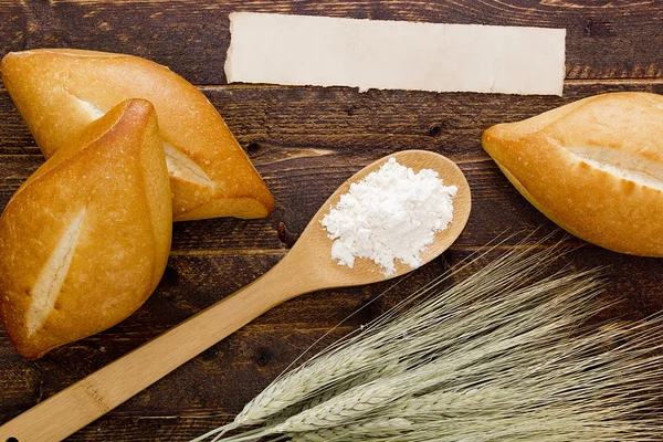 Bakery products flour in a wooden spoon — Stock Photo, Image