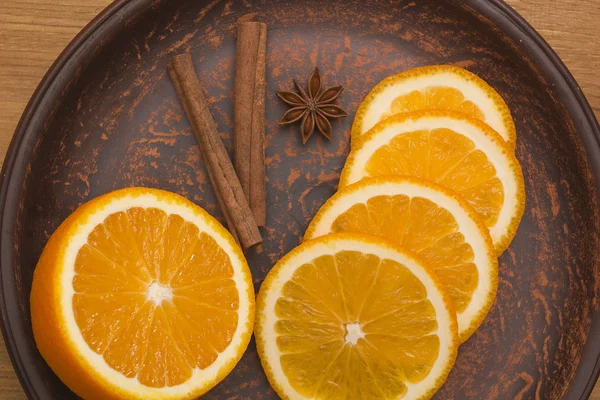 Orange with cinnamon and anise — стокове фото