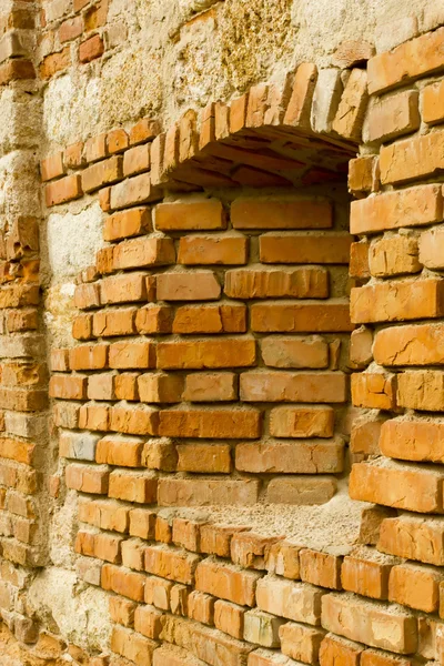 Fortress loop-hole in the brick wall — Stock Photo, Image