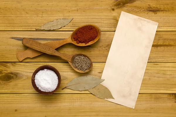 Spices and salt in a wooden shaker — Stock Photo, Image