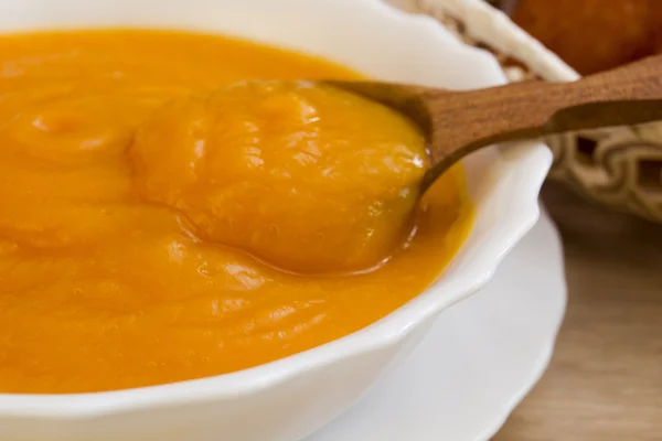 Pumpkin porridge in a deep white ceramic plate — Stock Photo, Image