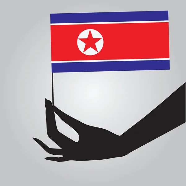 Mano con bandera Corea del Norte — Vector de stock