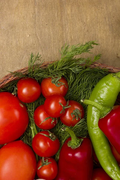 Tomatoes in a wicker basket — Stock Photo, Image