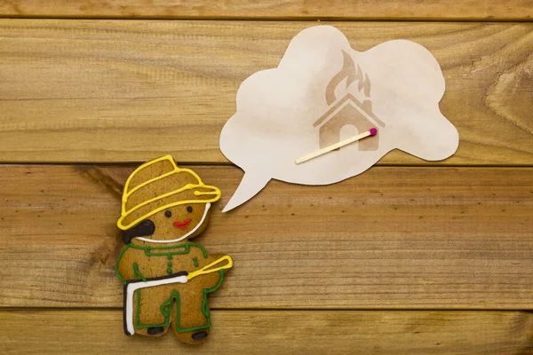 Cookies in the form of man firefighter — Stock Photo, Image